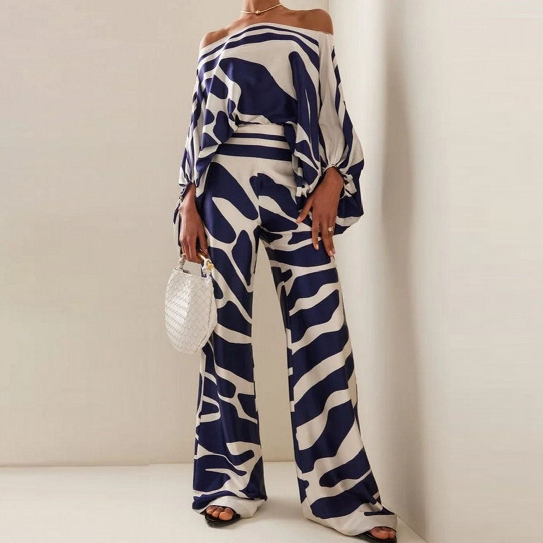 Silhouette chic avec cet ensemble femme deux pièces : top off-shoulder et pantalon large taille haute, idéal pour l'été.