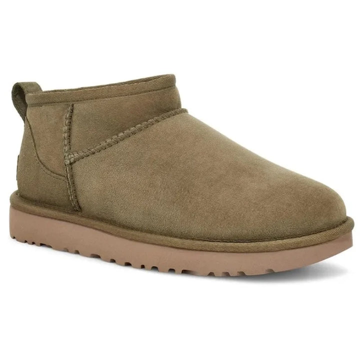 Vue latérale bottines d'hiver suédine pour femmes, chaudes, fourrées, style tendance et confort pour la neige.