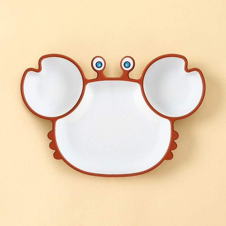 Vaisselle bébé ludique: assiette crabe en silicone alimentaire. Sûre, sans BPA, encourage l'indépendance de l'enfant.