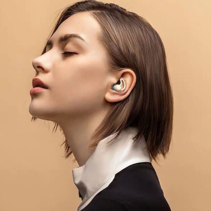 Paire de bouchons d'oreilles anti-bruit en silicone, parfaits pour la réduction sonore et la détente.