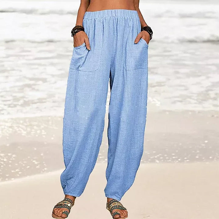 Pantalon femme lâche et fluide, style harem élégant pour printemps/été, look décontracté chic.