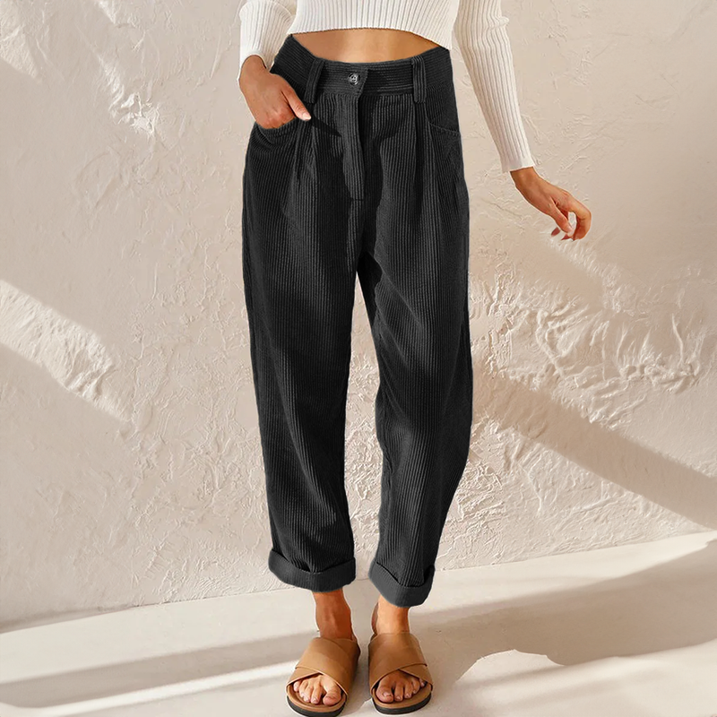 Pantalon femme en velours côtelé doux, coupe fluide et confortable. Vêtement tendance à taille élastique pour l'hiver.