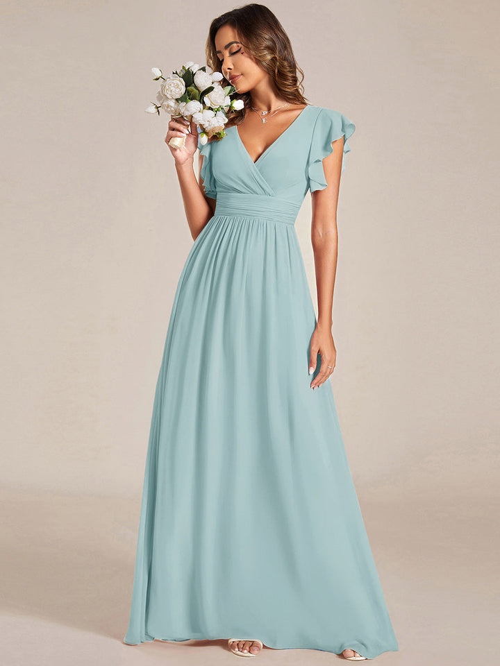 Robe longue femme, dos ouvert, col en V. Élégante pour une cérémonie ou soirée de printemps chic et stylée.