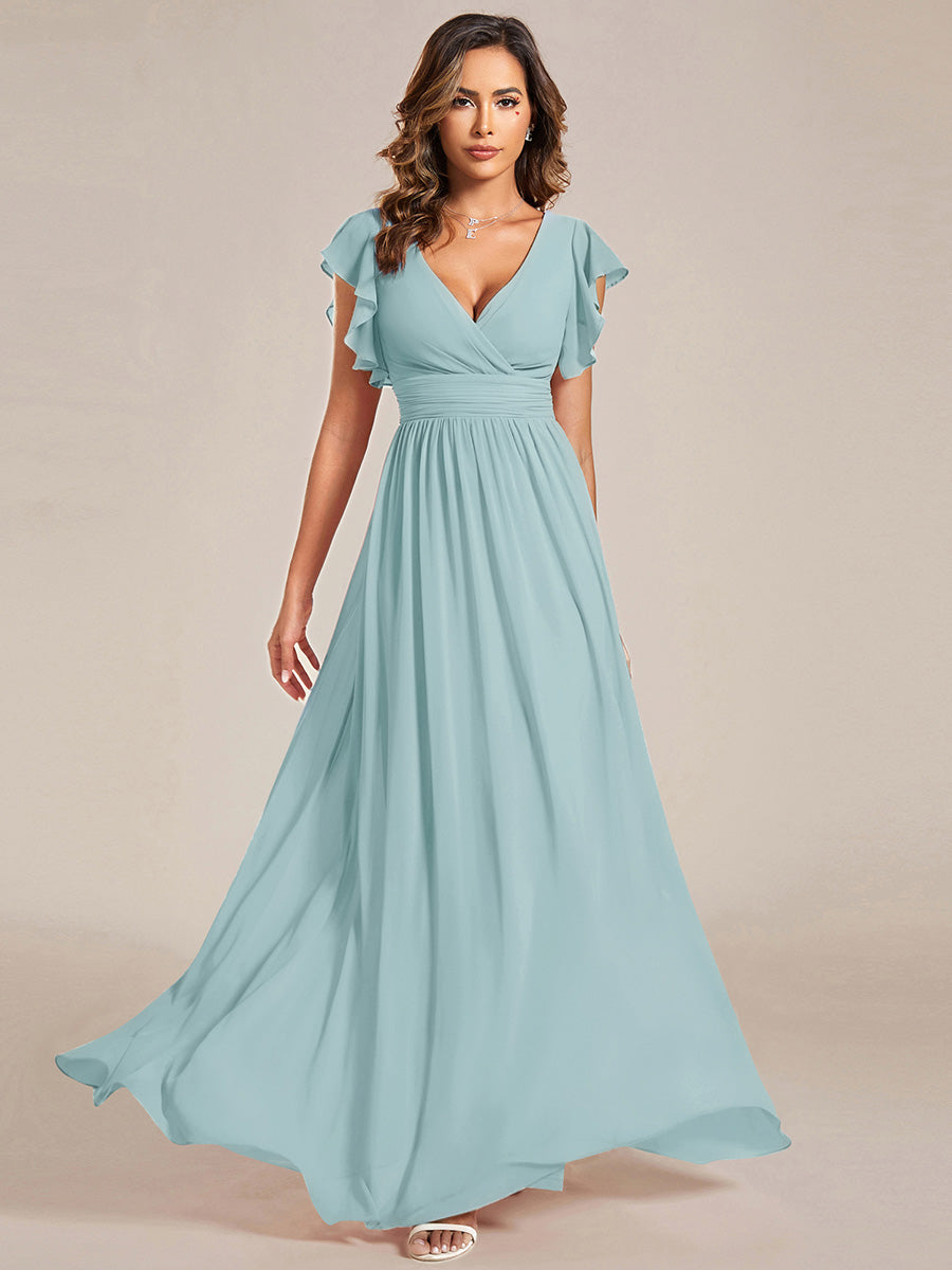 Robe de demoiselle d'honneur élégante, dos ouvert. Fluide et longue pour un mariage d'été en beauté et simplicité.