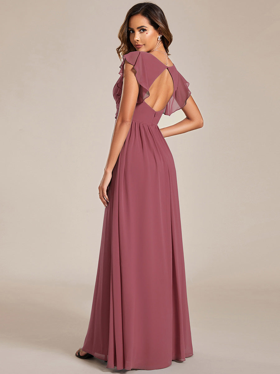 Robe de fête élégante, dos ouvert, manches courtes. Fluide et maxi pour une femme chic et branchée.