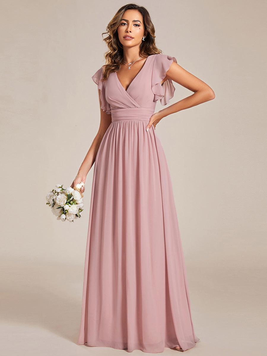 Robe longue élégante, dos ouvert, pour un mariage en plein air. Demoiselle d'honneur chic.