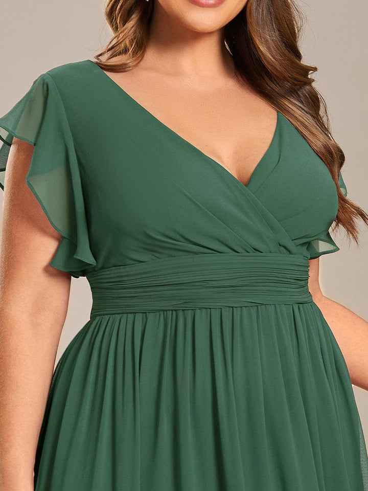 Robe de cérémonie femme, dos ouvert, col en V. Longue et fluide pour un look estival parfait.