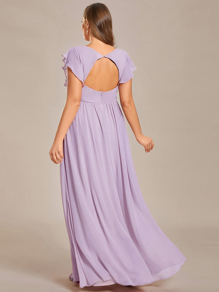 Robe de cérémonie femme, dos ouvert, col en V. Longue et fluide pour un look estival parfait et féminin.