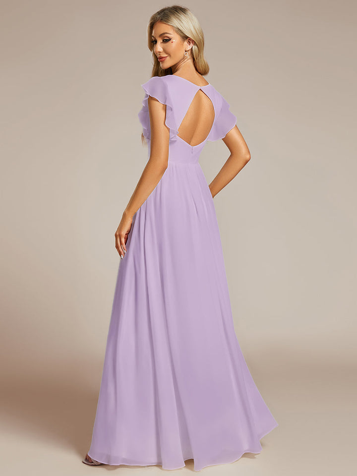 Robe de fête femme, dos ouvert, manches courtes. Fluide et maxi pour un look estival élégant et lumineux.
