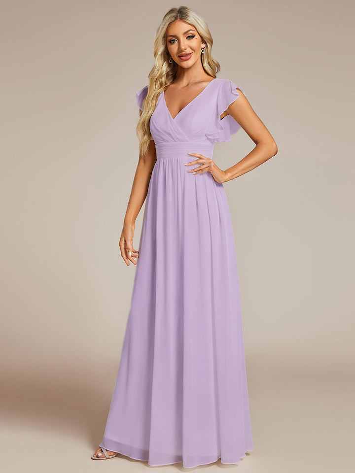 Robe fluide, dos ouvert, col en V. Élégante pour demoiselle d'honneur, longue et pour cérémonie estivale chic et douce.
