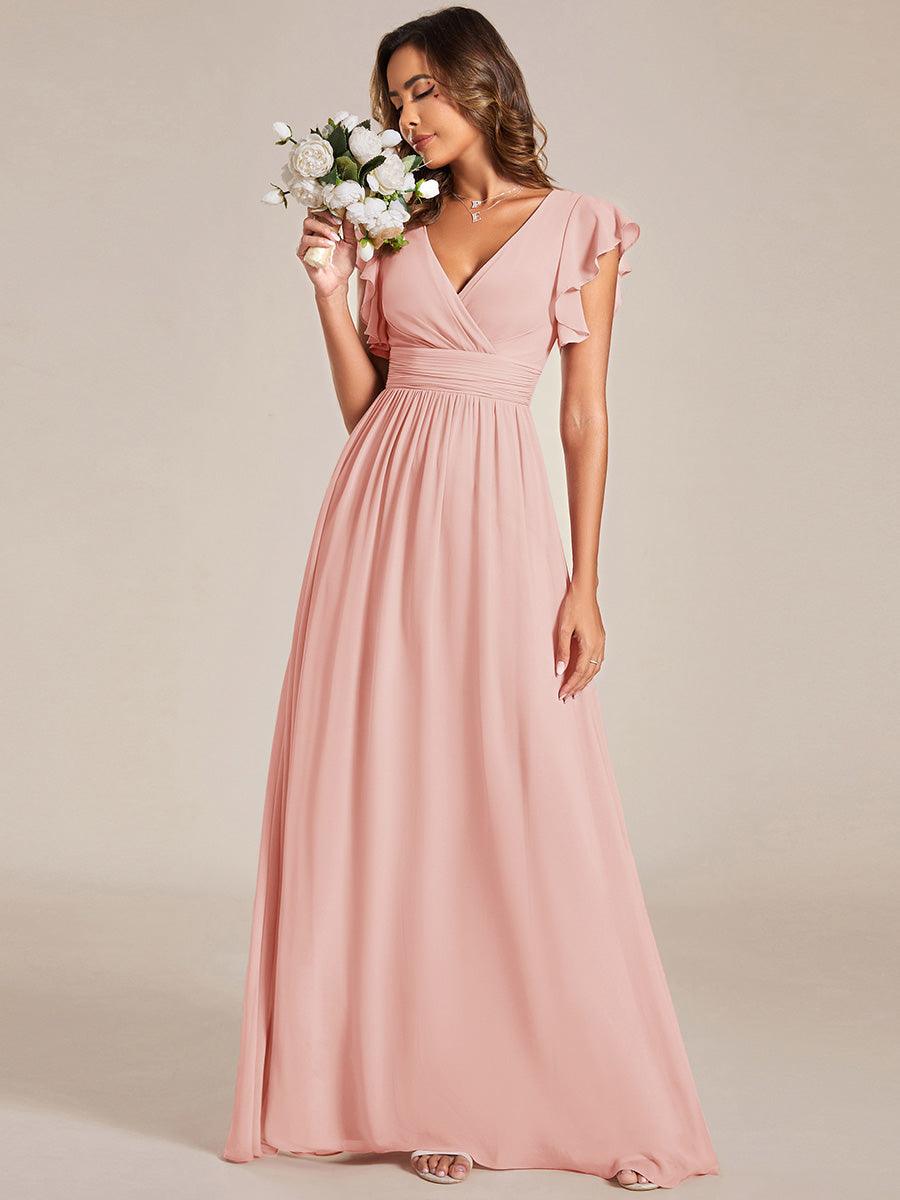 Robe de demoiselle d'honneur élégante, dos ouvert. Fluide et longue pour un mariage d'été poétique.