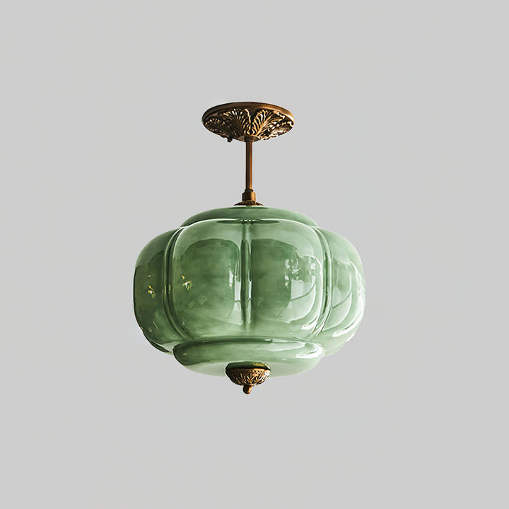 Lampe de plafond en verre à design moderne, forme arrondie, pour un éclairage élégant du salon.