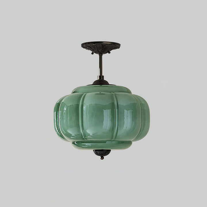 Lampe de plafond en verre, design pur et rond, offre une lumière douce et moderne.
