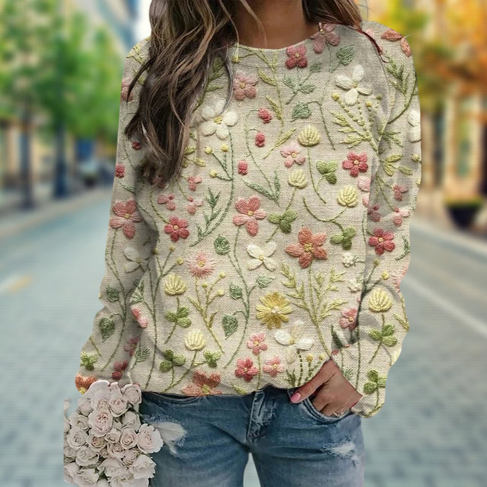 Mode femme : pull décontracté en tricot, motifs floraux en relief, idéal pour le printemps. Confort et style.