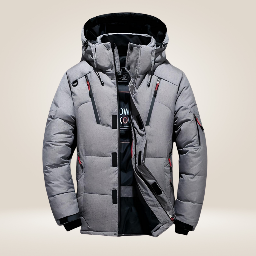 Gros plan sur la texture matelassée de la veste d'hiver homme, synonyme de chaleur garantie.