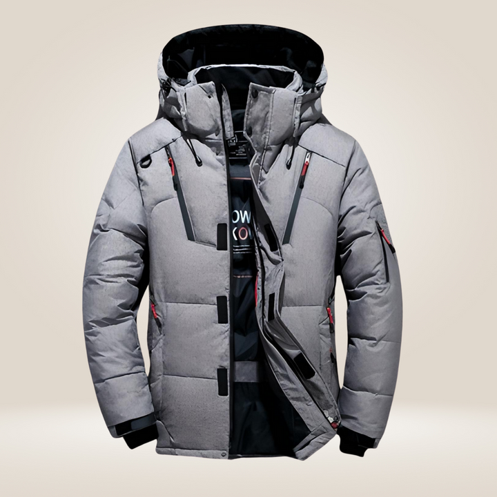 Gros plan sur la texture matelassée de la veste d'hiver homme, synonyme de chaleur garantie.