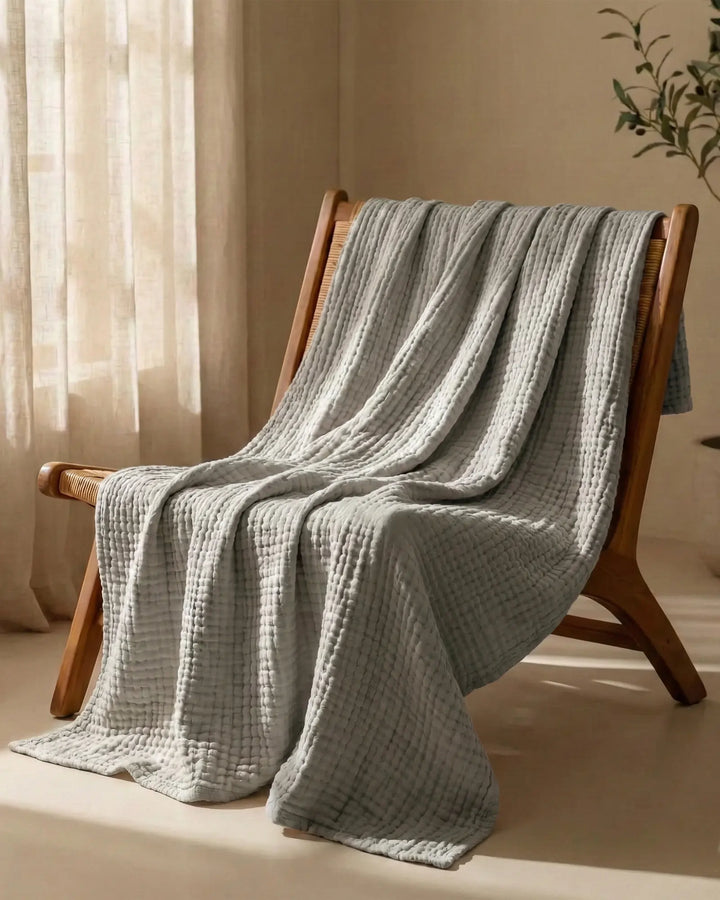 Plaid en mousseline de coton, confort naturel, léger et respirant pour votre espace de vie.