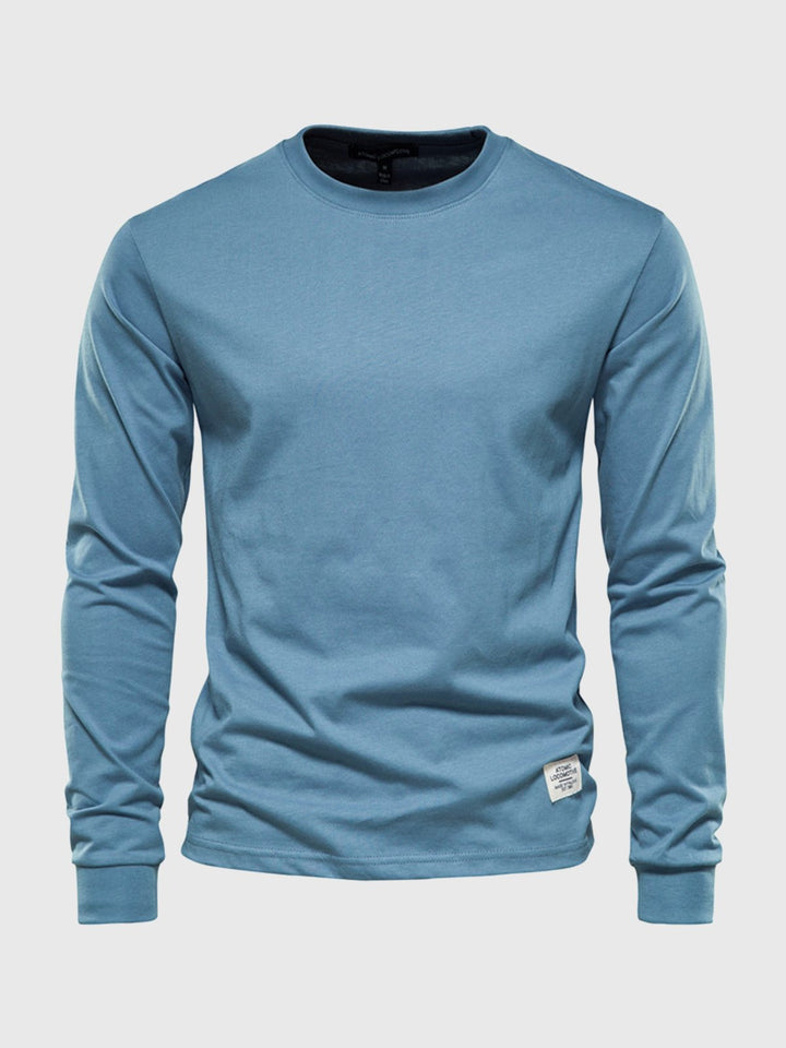 Pull basique homme, col rond, manches longues. Indispensable pour un style quotidien en hiver.
