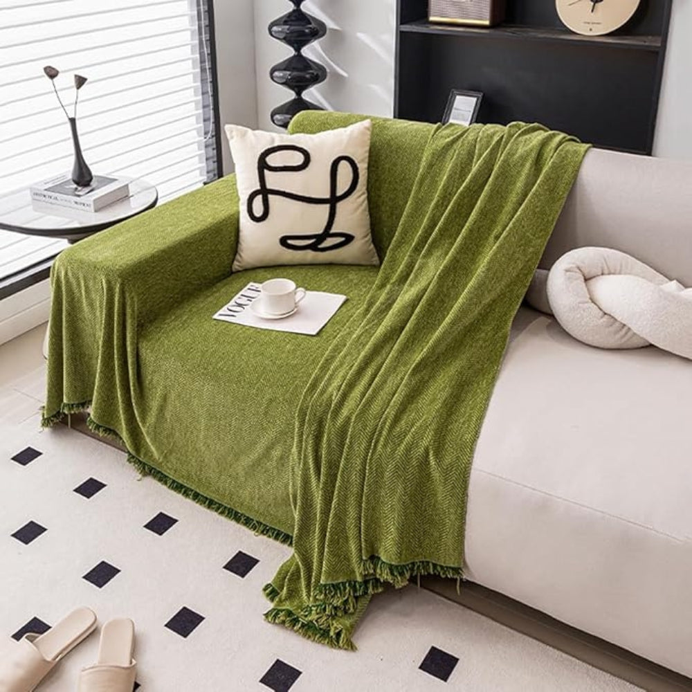 Housse de canapé lavable, texturée et décorative avec pampilles. Protection optimale pour le salon.