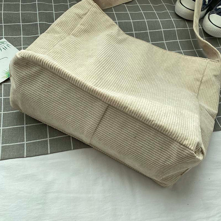 Sac à main femme en velours côtelé marron, décontracté et spacieux, avec bandoulière réglable.