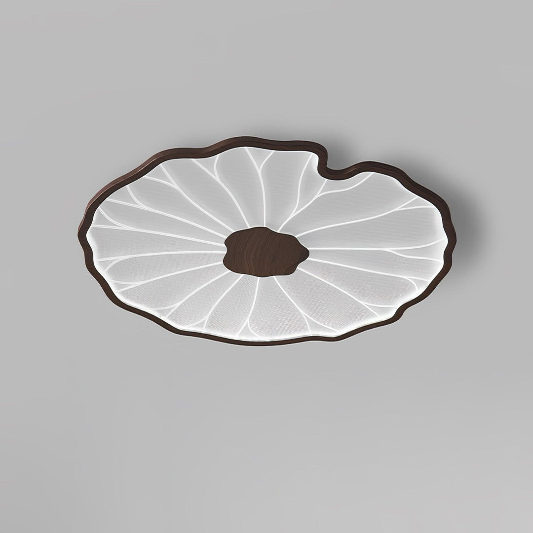 Plafonnier LED Solara, feuille de lotus, bois naturel, crée une atmosphère accueillante.
