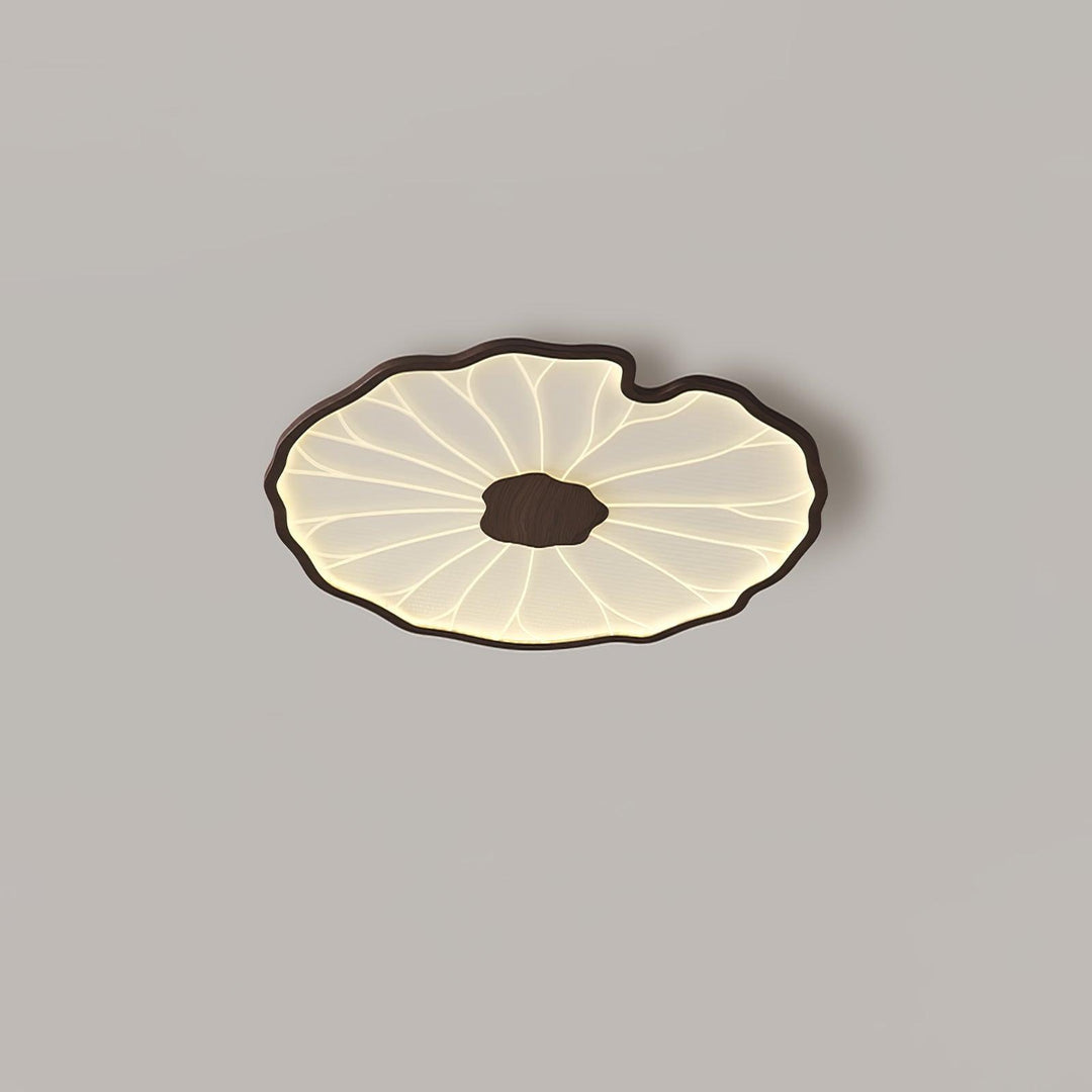 Plafonnier LED Solara, motif feuille de lotus stylisé en bois naturel, éclairage optimal.