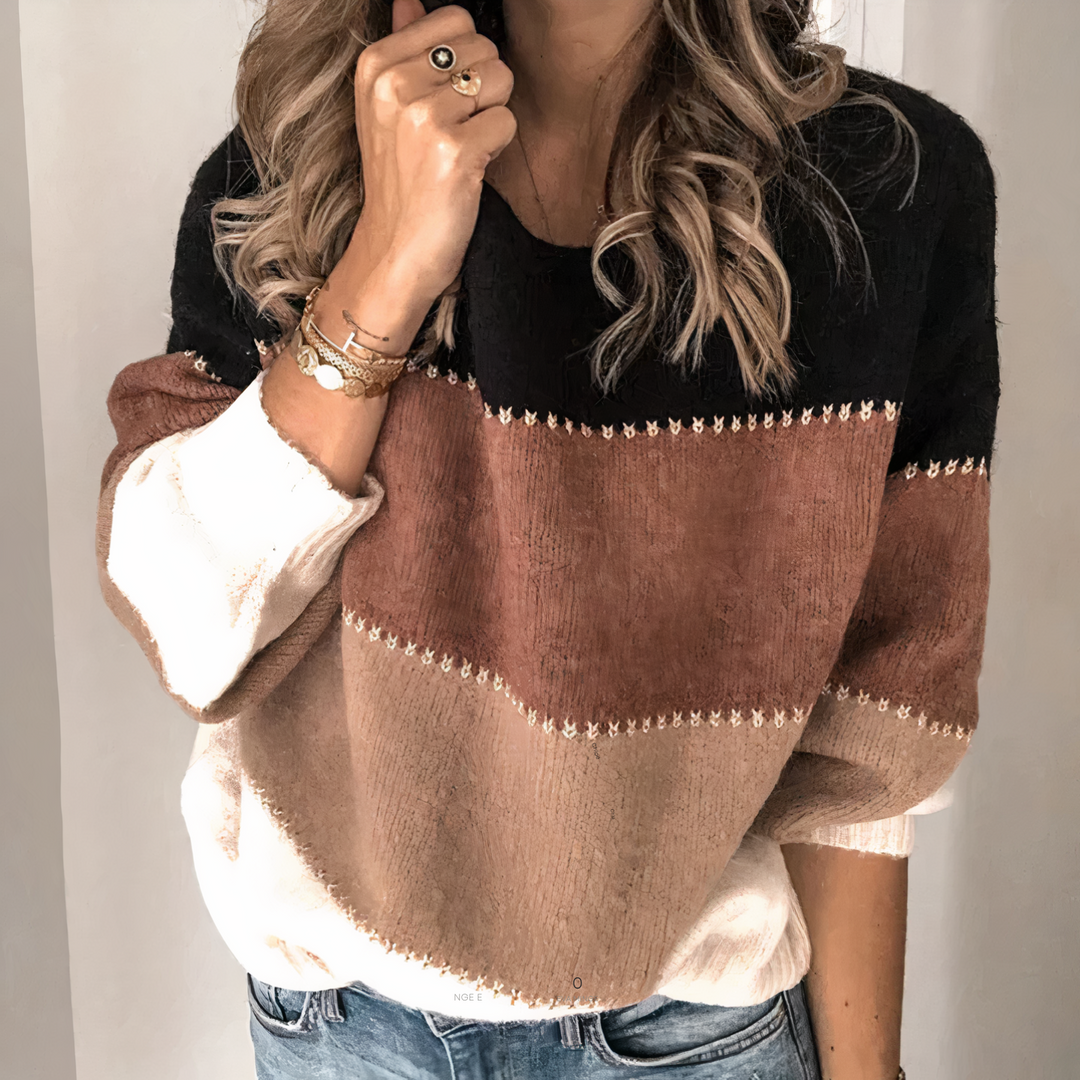 Haut femme doux et élégant à rayures. Ce pull tricoté offre chaleur et style pour la mode hivernale.