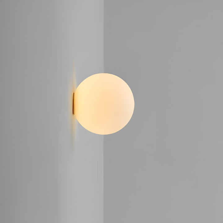 Applique design minimaliste, ronde avec éclairage LED doux intégré, parfaite pour une lumière d'ambiance.