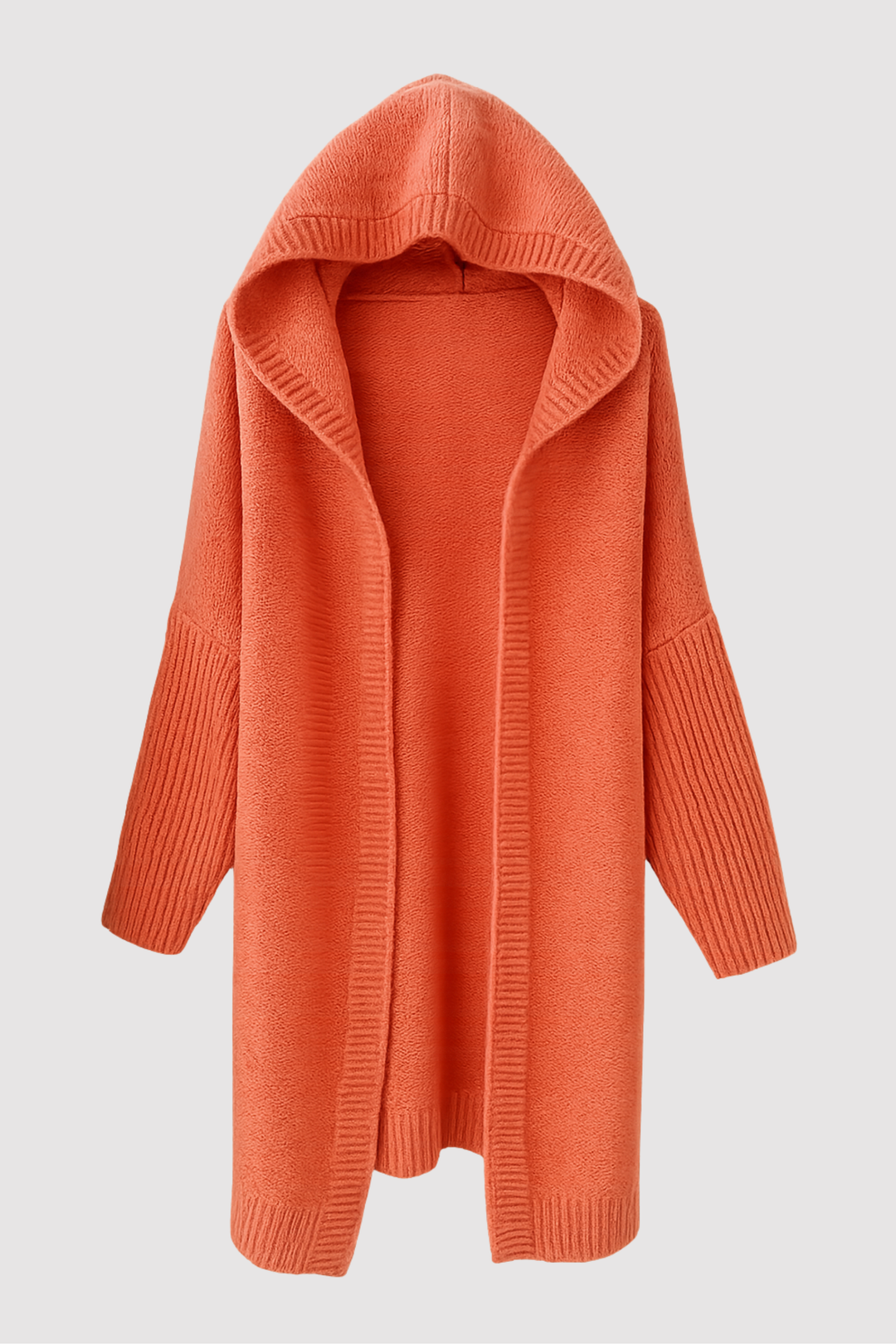 Gros plan sur la texture du cardigan douillet pour femme, maille douce et chaude, confort optimal en hiver.