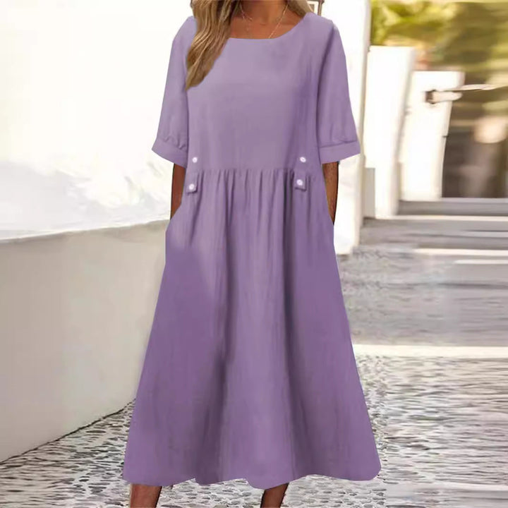 Robe femme ample mi-longue en coton lin, parfaite pour l'été. Style décontracté et confortable.