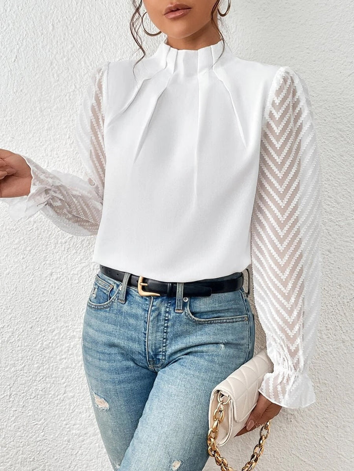Chemisier femme Sophie élégant, motif moderne et manches longues. Un haut polyvalent pour toute occasion.