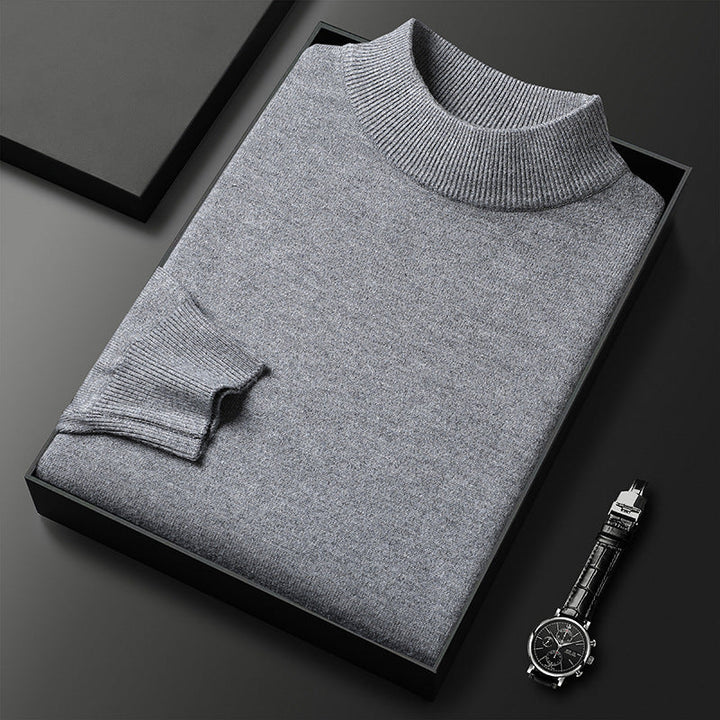 Pull homme noir élégant col mi-montant, idéal pour l'hiver, confort et style mode masculine.