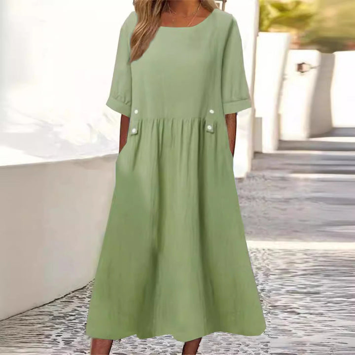 Robe d'été mi-longue en coton lin pour femme, coupe ample et élégante. Confort et style décontracté garantis.