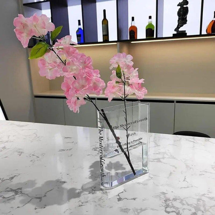 Vase moderne transparent pour fleurs, design unique, idéal pour salon contemporain.