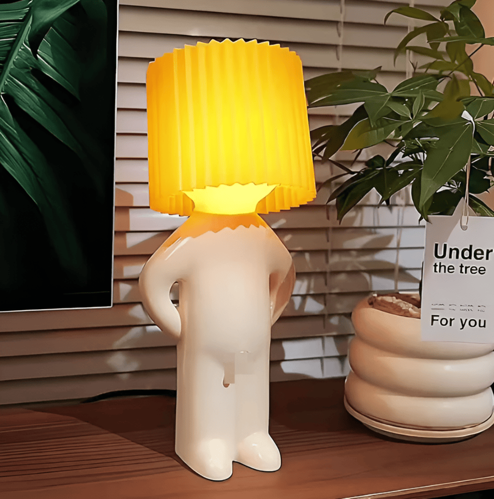 Lampe de table LED design figuratif, lumière douce pour ambiance chaleureuse et moderne.