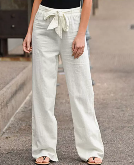 Modèle de pantalon femme taille haute à cordon, jambe large, pour un confort optimal et un look estival.
