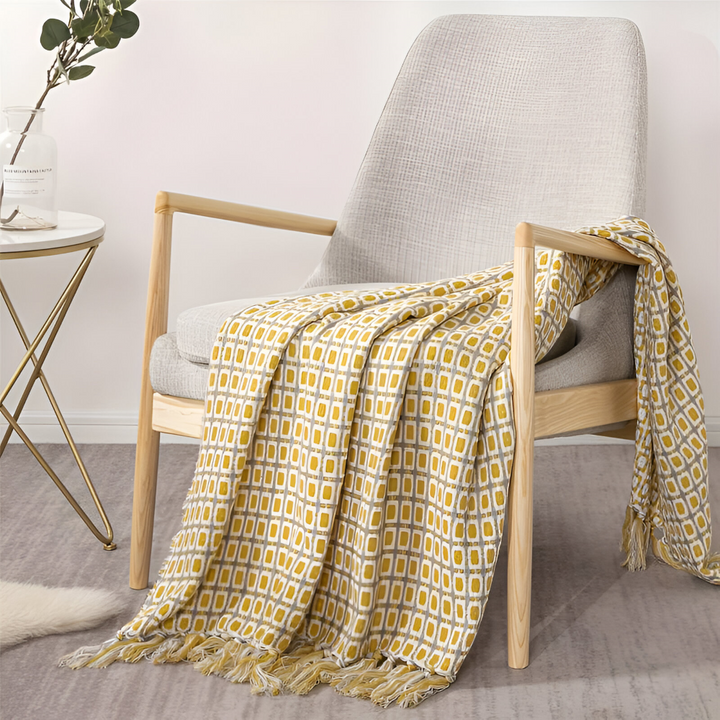 Couverture polaire légère et douce, style vintage avec franges, parfaite pour toutes saisons et décoration.