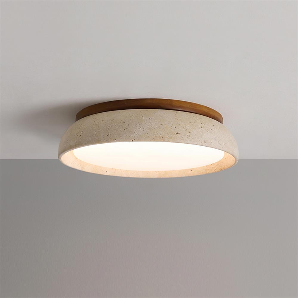 Luminaire rond en pierre de travertin, texture naturelle unique pour un éclairage design.