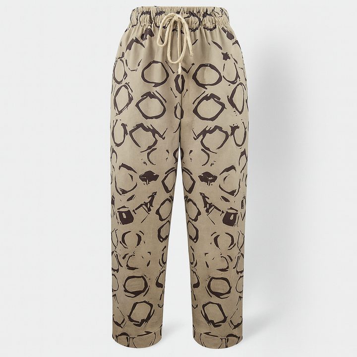 Pantalon femme élégant en coton et lin beige, coupe décontractée pour l'été. Confortable et respirant.