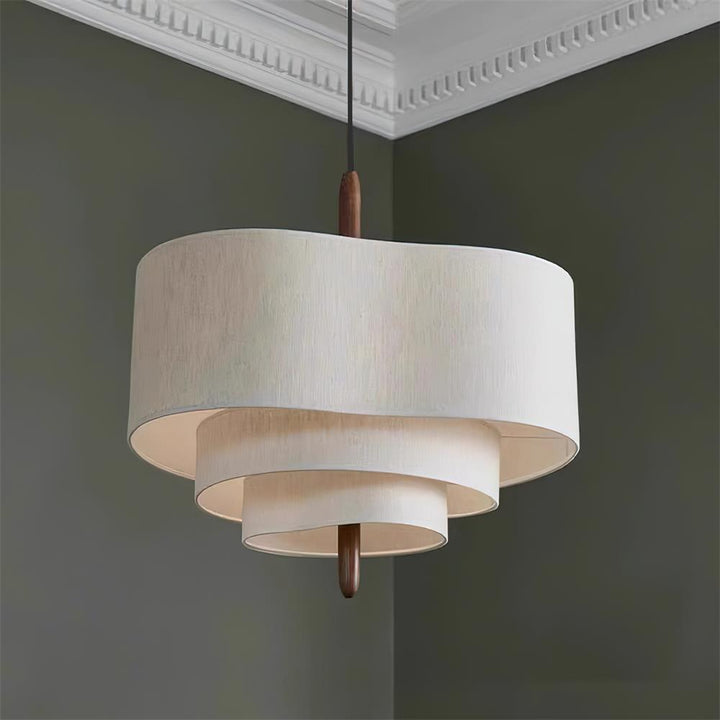 Luminaire contemporain, suspension ronde en tissu, lumière douce pour un intérieur stylé.