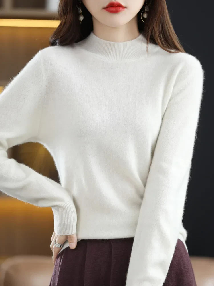 Vêtement femme mode : pull col montant vert sapin, doux et intemporel pour l'hiver.