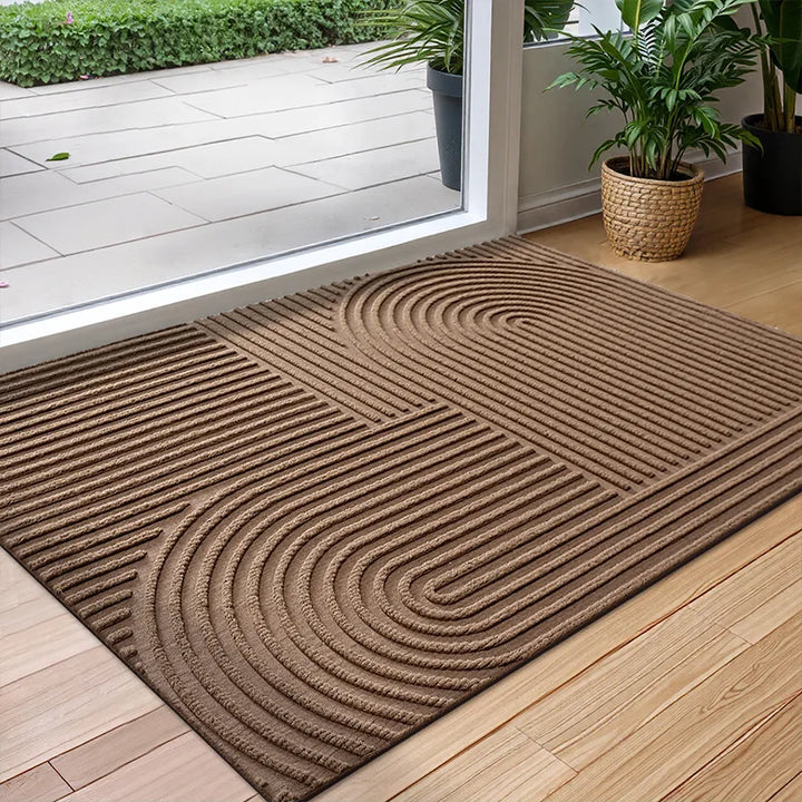 Paillasson résistant en polyester durable, absorbant et antidérapant. Parfait pour intérieur ou extérieur, facile d'entretien.