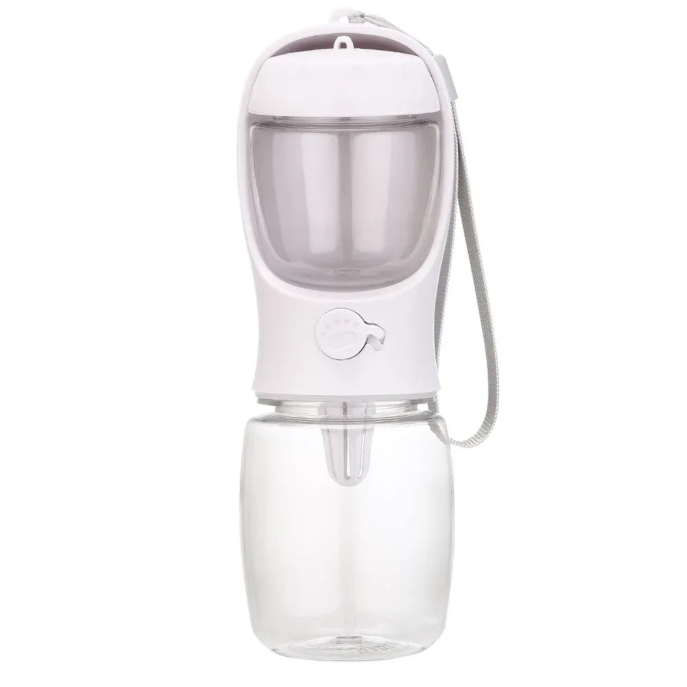 Bouteille d'eau compacte avec distributeur de friandises intégré pour animaux. Essentielle pour les sorties et voyages.
