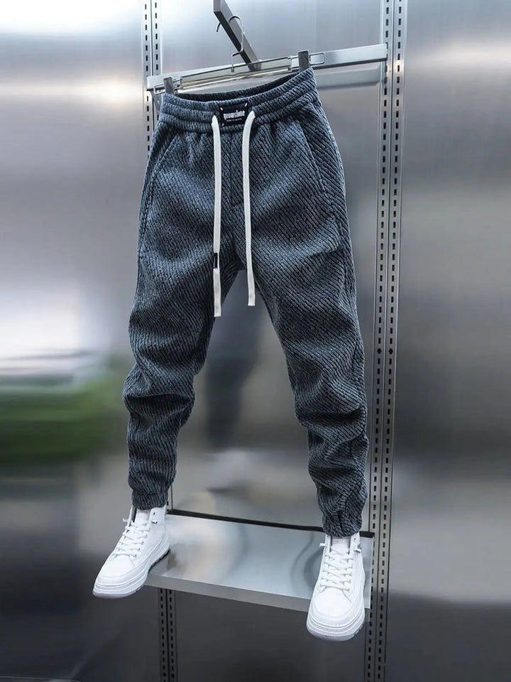 Jogging homme, style athleisure pour un confort optimal. Parfait pour le sport, la détente et la mode urbaine moderne.