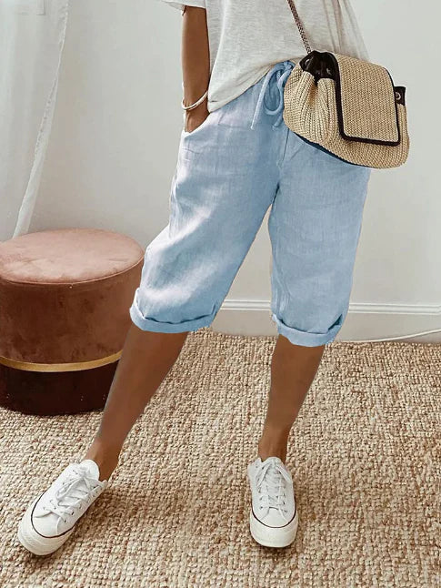 Pantalon femme fluide et chic, taille haute, offrant un style décontracté et un grand confort pour l'été.