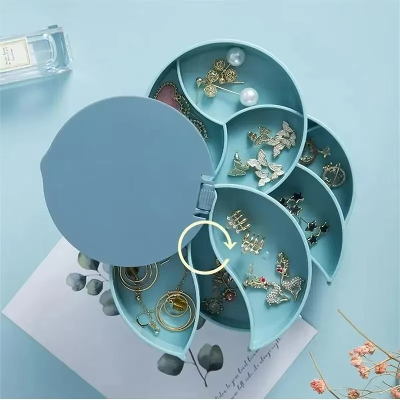 Boîte à bijoux rotative noire, organisateur compact pour coiffeuse femme, rangement élégant d'accessoires en ABS.