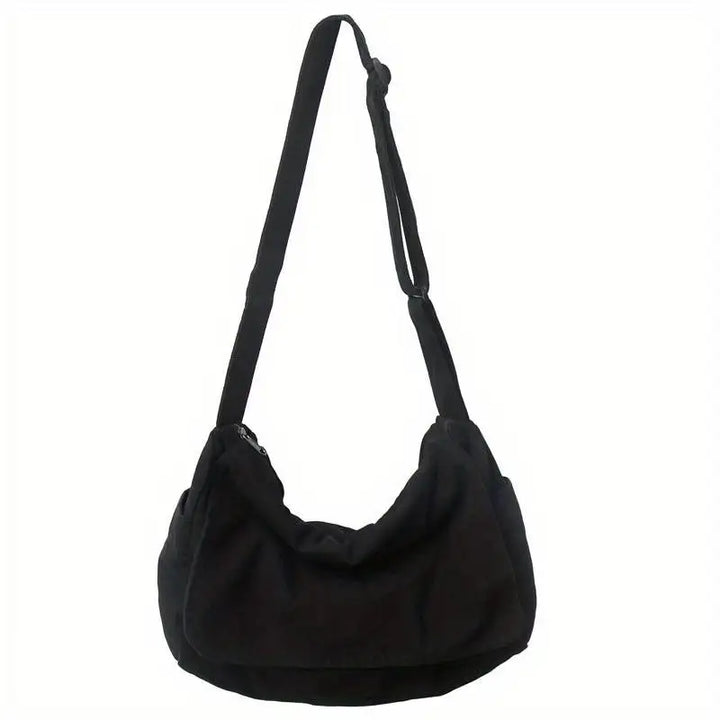 Sac besace unisexe léger et pratique en tissu recyclé. Accessoire écoresponsable pour le quotidien, design moderne.