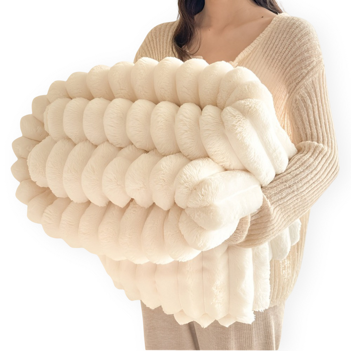 Jeté de lit polaire doux, parfait pour ajouter une couche de confort et de chaleur à votre chambre.
