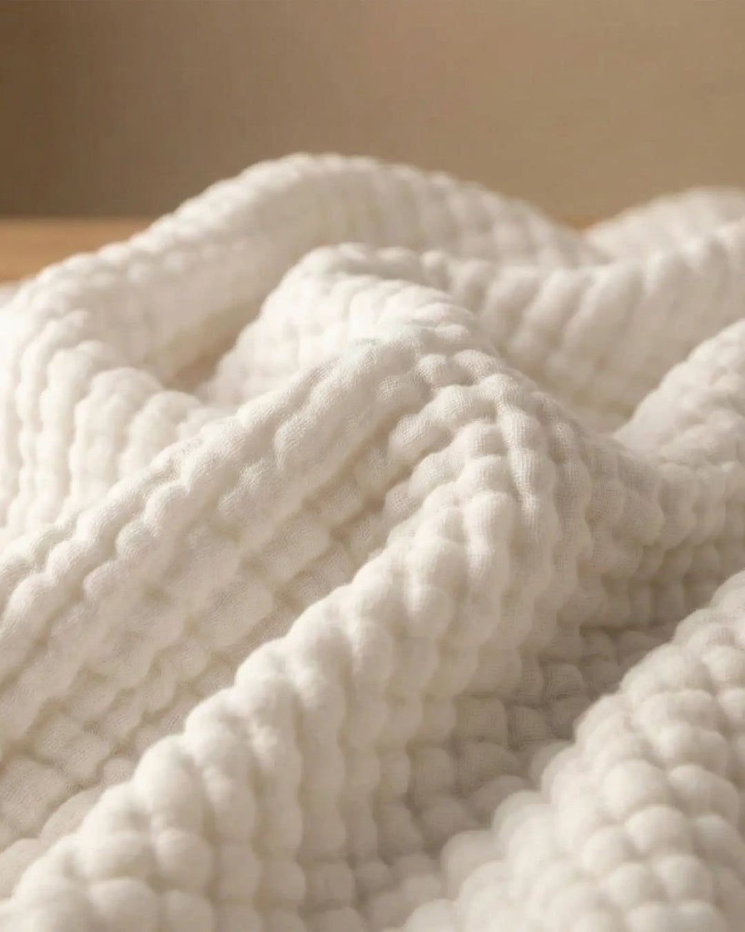 Couverture en coton doux, naturelle et élégante, apporte chaleur légère et confort à la maison.