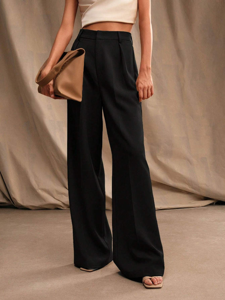 Pantalon femme taille haute plissé, jambes larges, élégant pour bureau ou look chic.